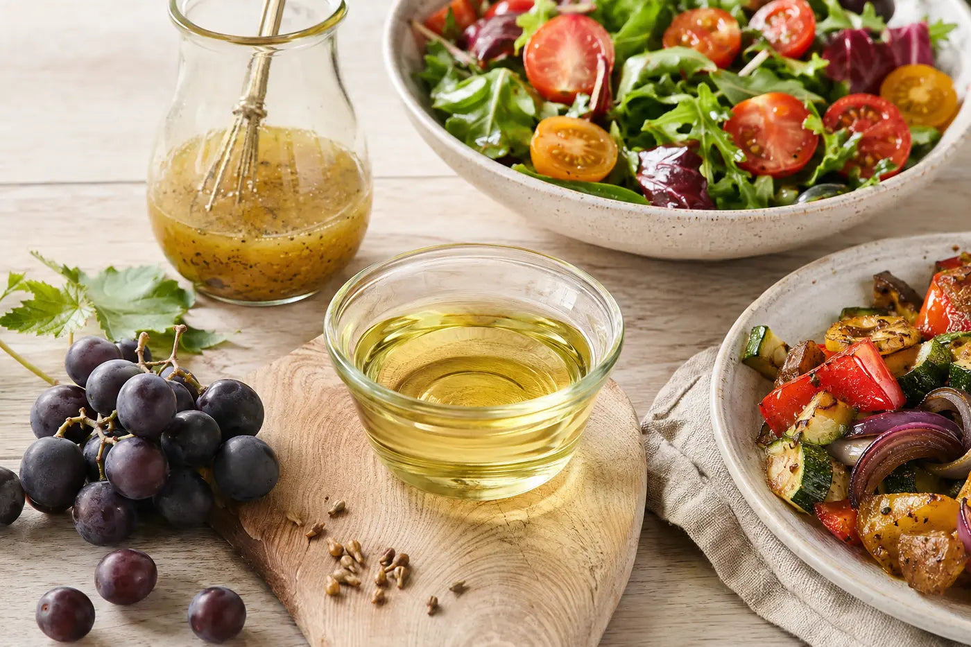 Grapeseed oil with vinaigrette, salad and roasted vegetables