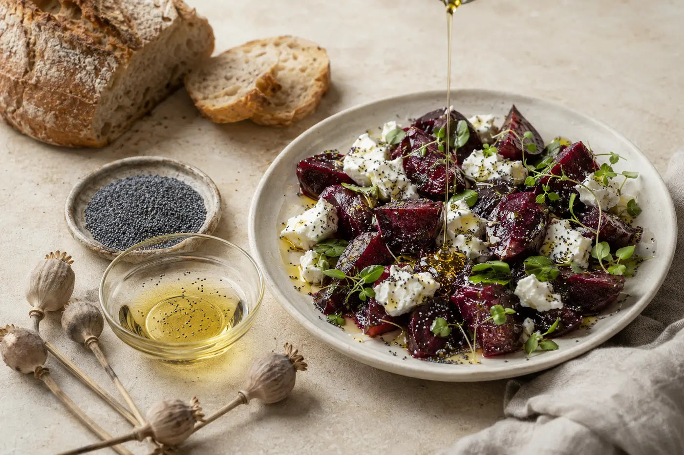 Poppy seed oil drizzled over beetroot and goat cheese salad