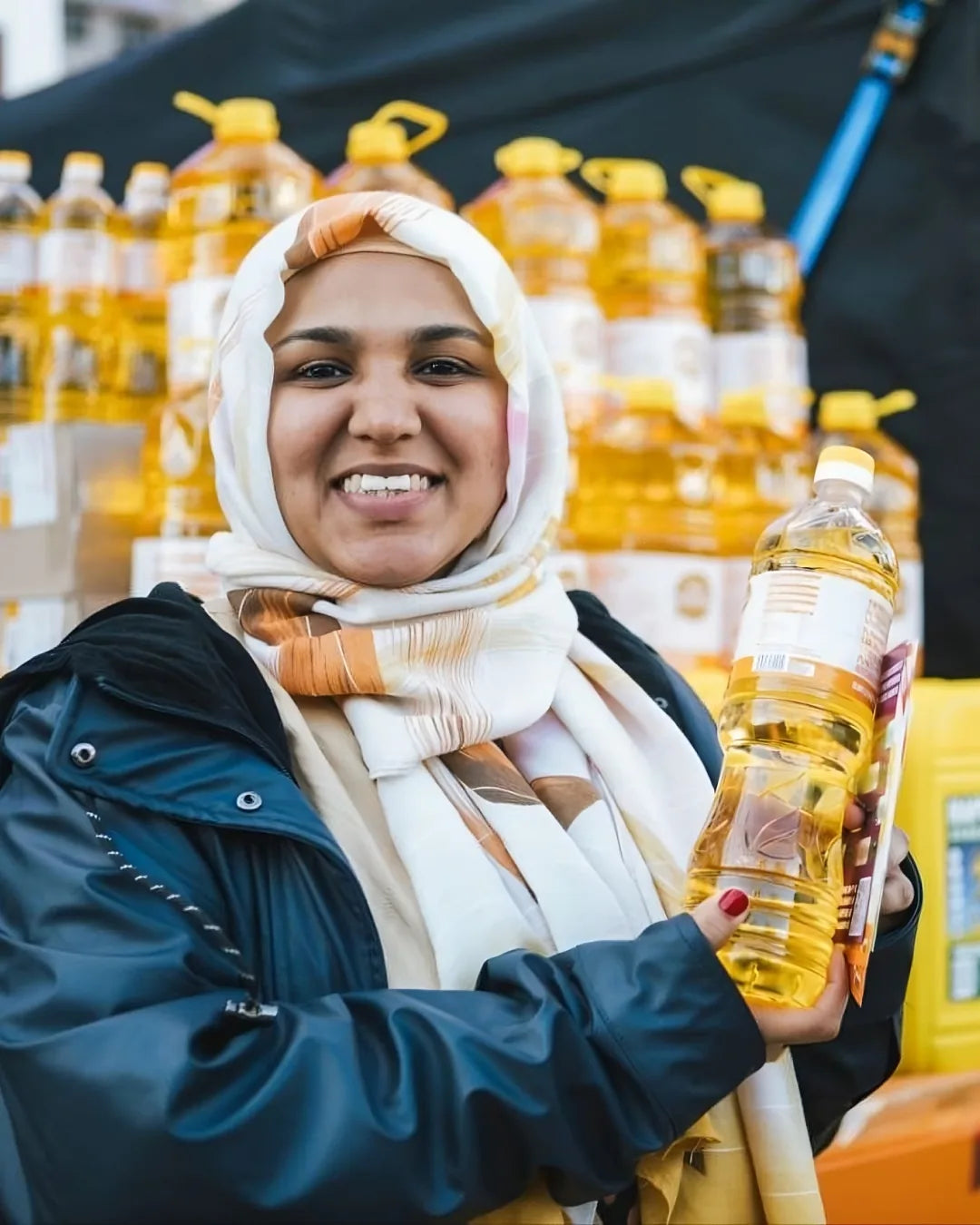 I’m a Natural customer holding a bottle of oil